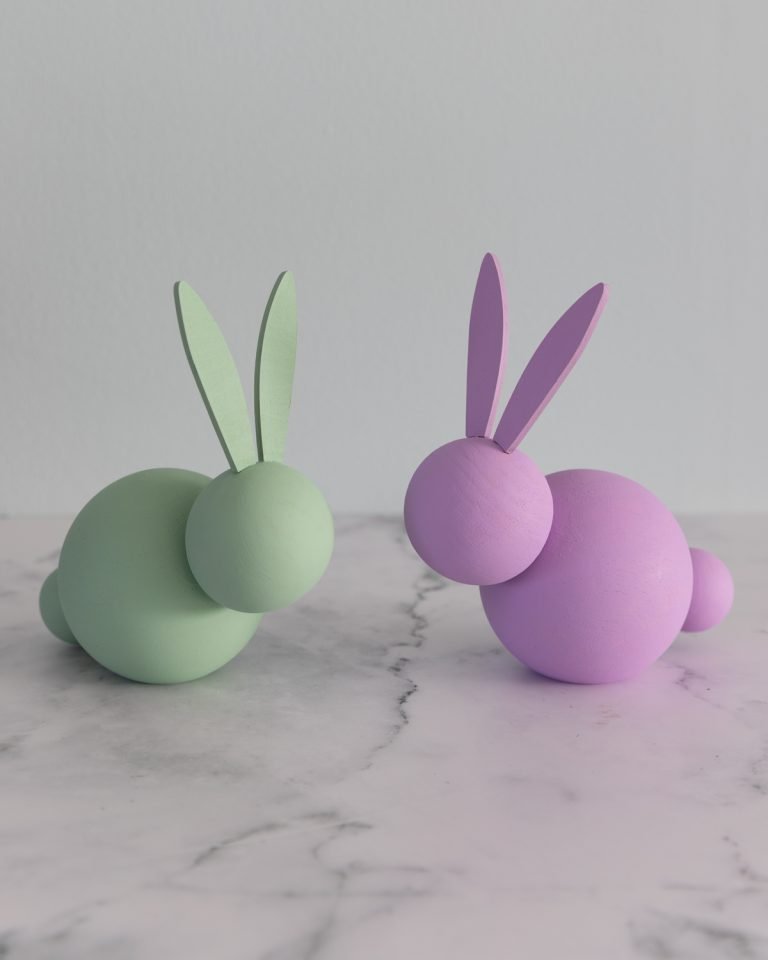 green and purple wooden bunnies