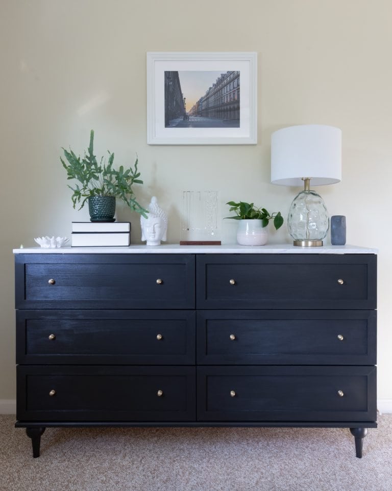 Anthropologie Inspired IKEA Dresser hack styled with a lamp and decorative items.